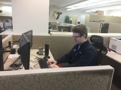 Elliott Walda chats with students who need assistance online at the Help Desk in the Charles V Park Library on the campus of Central Michigan University, February 23, 2017.