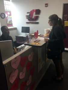 Chuck Mahone assists student at the Office of Student Activities and Involvement on the campus of Central Michigan University, February 23, 2017.